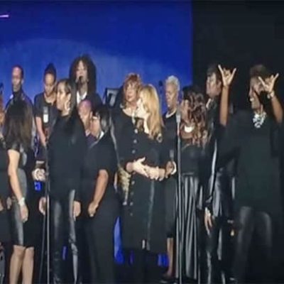 D’yann Elaine Interpreting with KJLH Performance Choir at Stevie Wonder’s House Full of Toys Concert, Los Angeles Forum, Inglewood, 2014